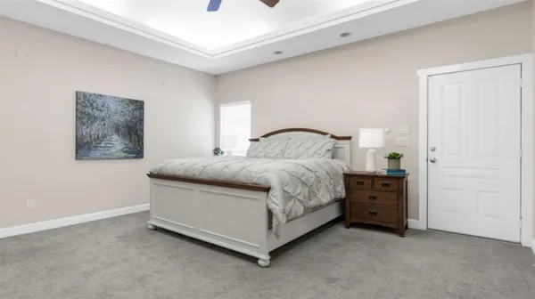 a bedroom with a bed and a cabinets