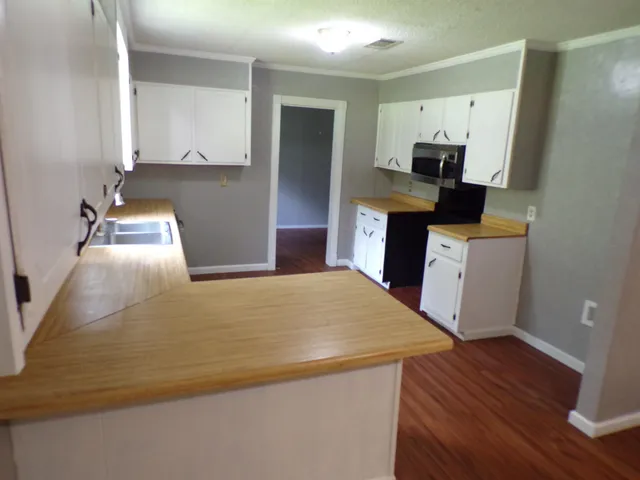 a bedroom with a bed and furniture