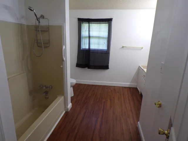 a bathroom with a bathtub and a shower