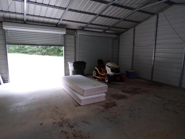 a view of backyard with cabin