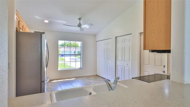 an empty room with windows and closet