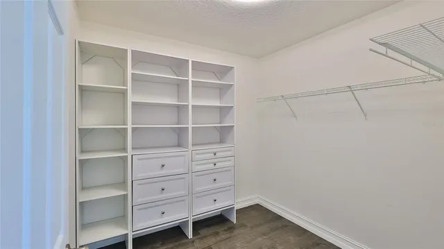 a view of an empty walk in closet
