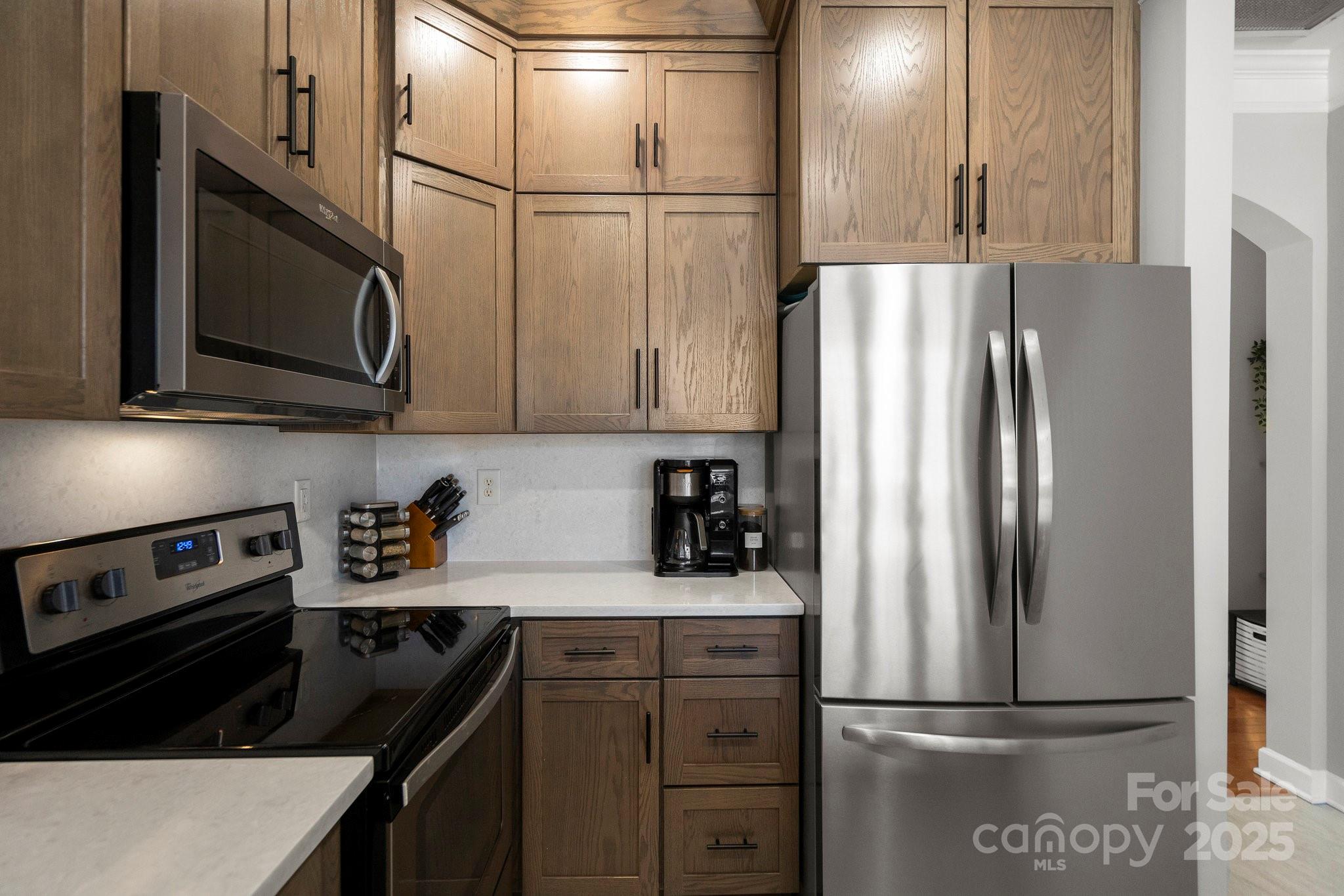 164 Singleton Road Mooresville, NC 28117 - Photo 13 of 36 a kitchen with a refrigerator stove and microwave