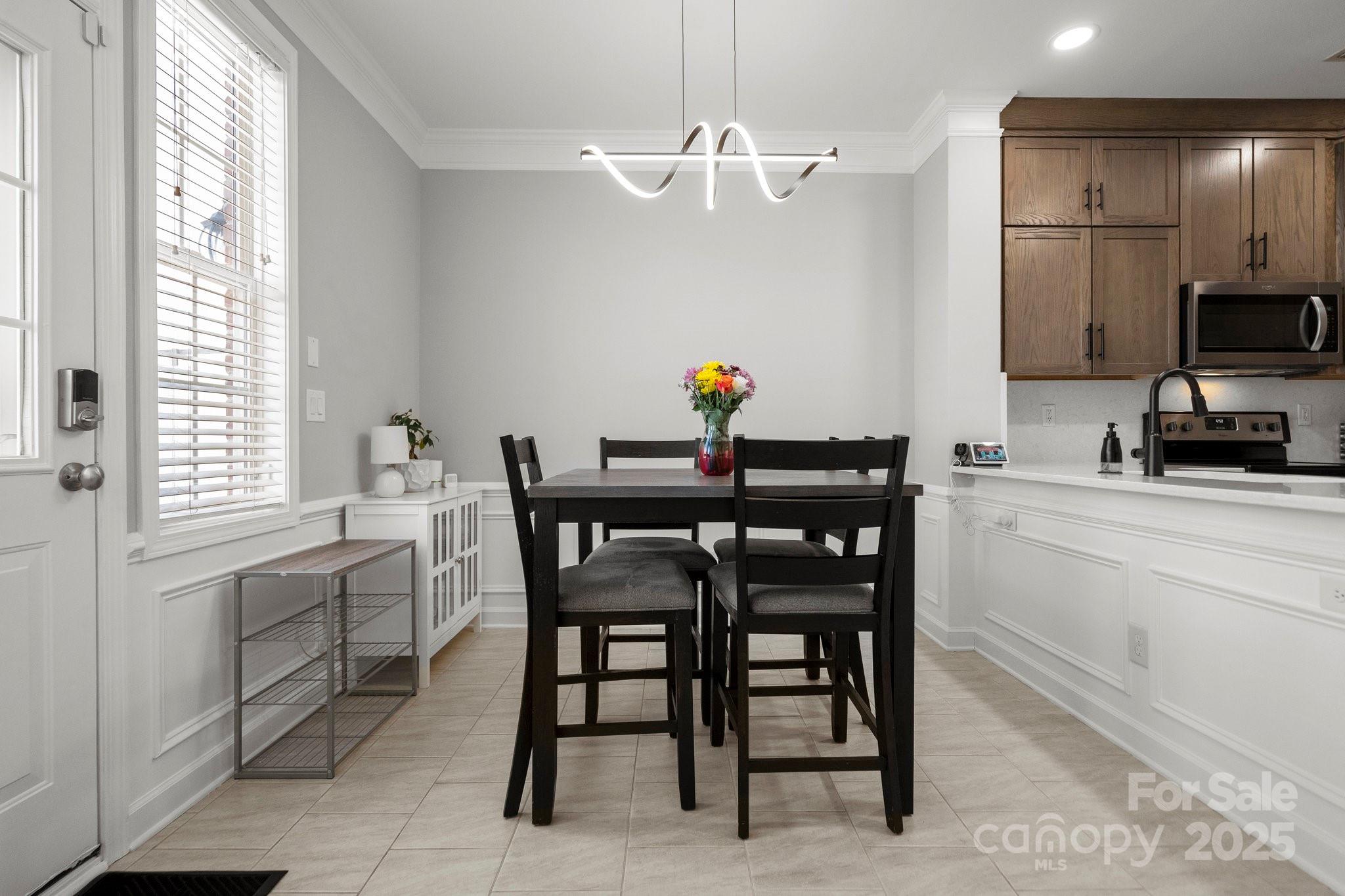 164 Singleton Road Mooresville, NC 28117 - Photo 15 of 36 a kitchen with a table and chairs in it