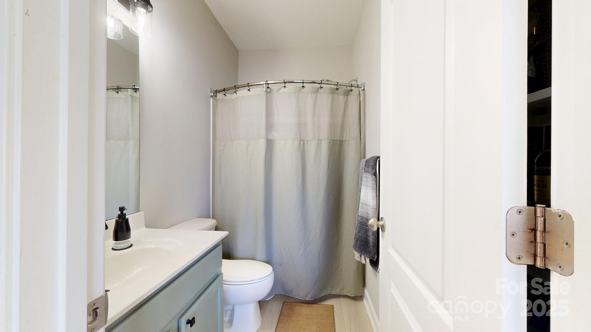 164 Singleton Road Mooresville, NC 28117 - Photo 22 of 36 a bathroom with a sink toilet and shower