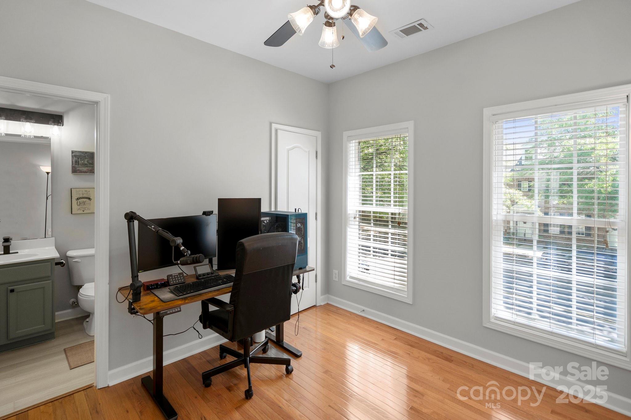 164 Singleton Road Mooresville, NC 28117 - Photo 23 of 36 a view of a workspace with furniture and a window