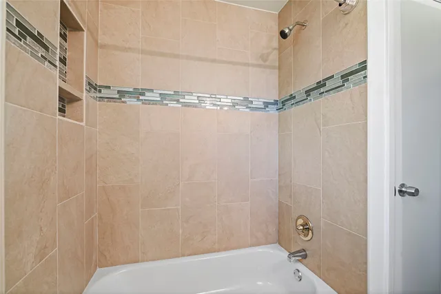 a bathroom with a shower and a shower