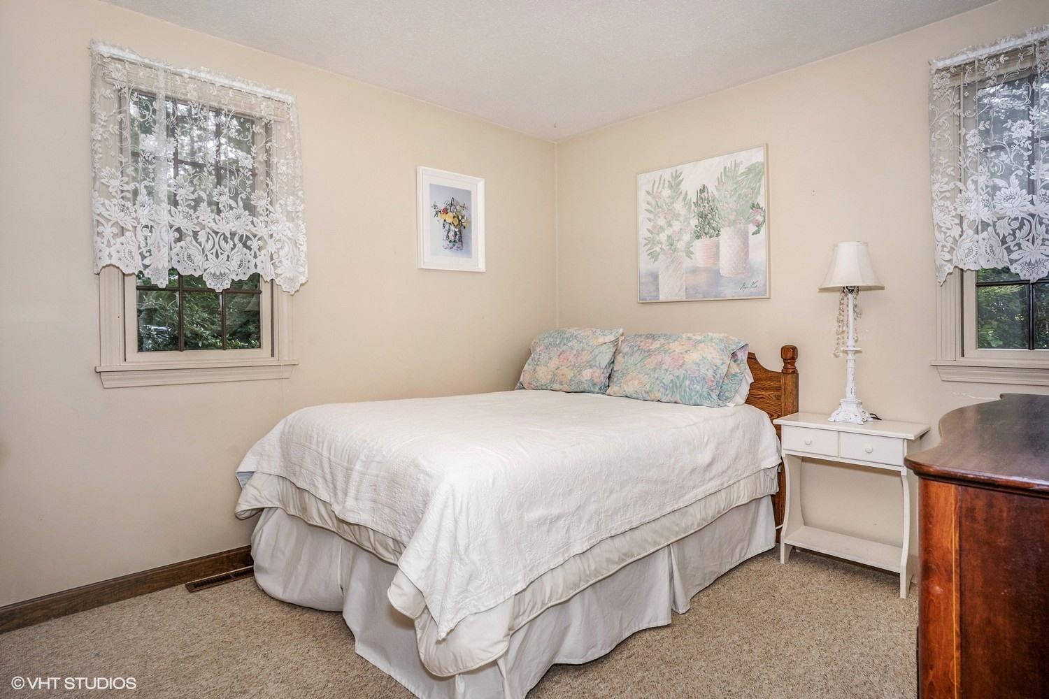 14 Nathan Road Centerville, MA 02632 - Photo 11 of 16 a bedroom with a bed and a lamp on dresser