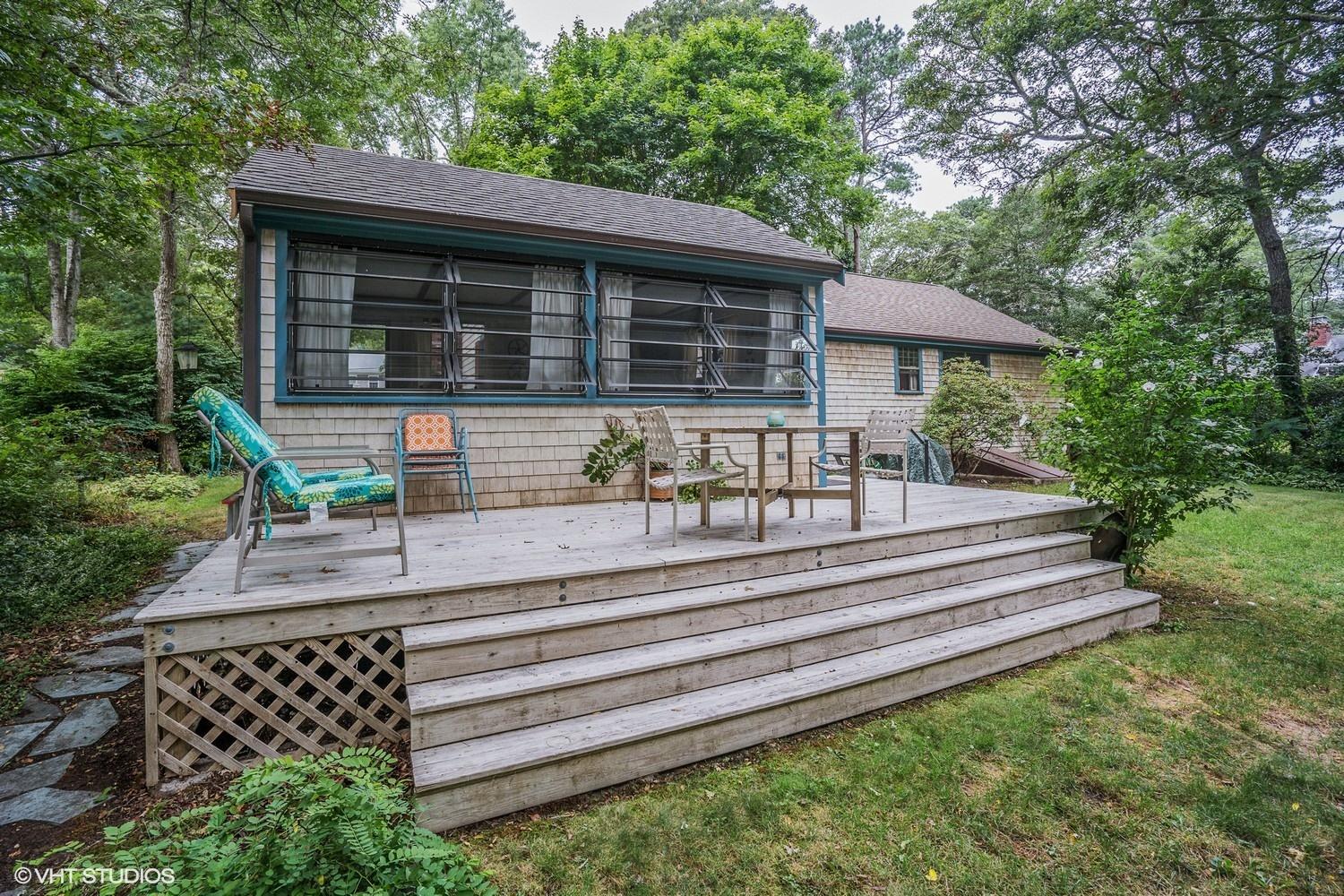 14 Nathan Road Centerville, MA 02632 - Photo 13 of 16 a front view of a house with a yard