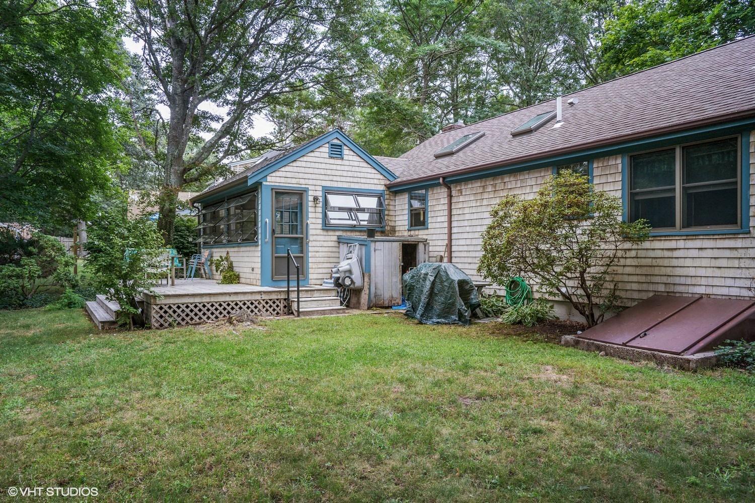 14 Nathan Road Centerville, MA 02632 - Photo 14 of 16 a front view of a house with a garden
