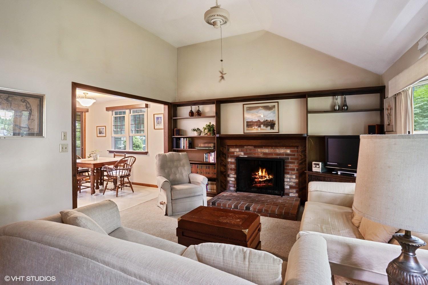 14 Nathan Road Centerville, MA 02632 - Photo 2 of 16 a living room with furniture a fireplace and a large window