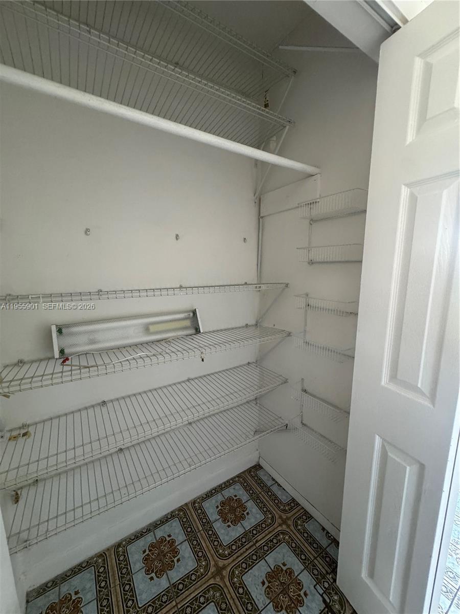 3690 Southwest 14th Street, Unit 1 Miami, FL 33145 - Photo 5 of 13 a bathroom with a sink and a shower