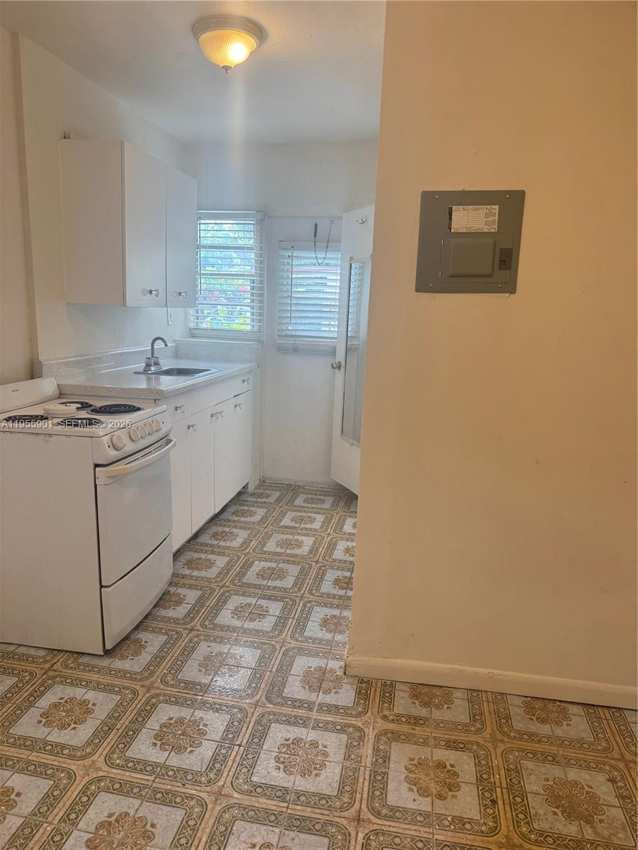 3690 Southwest 14th Street, Unit 1 Miami, FL 33145 - Photo 7 of 13 a bathroom with a sink and a mirror