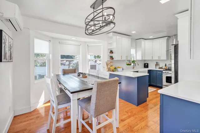 a kitchen with stainless steel appliances granite countertop a refrigerator a stove and a sink with dishwasher