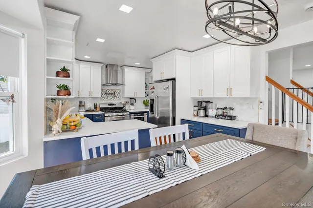 a kitchen with a white stove top oven and cabinets