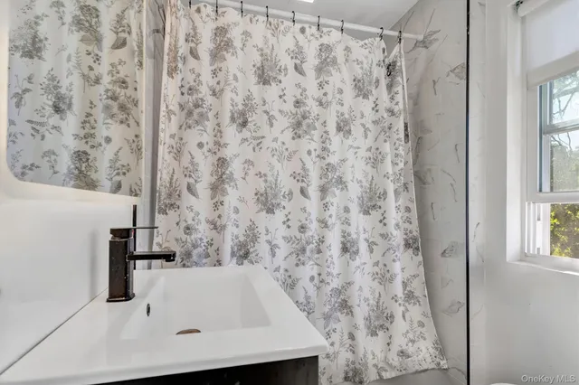 a view of a storage & utility room with closet dryer