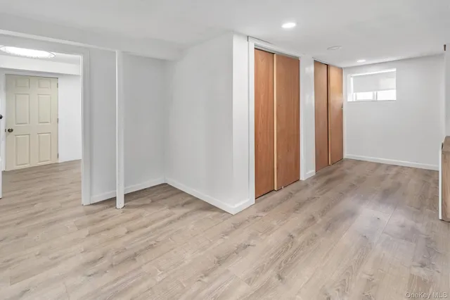 a bedroom with a bed and a tv