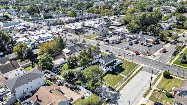 a aerial view of a house with a yard