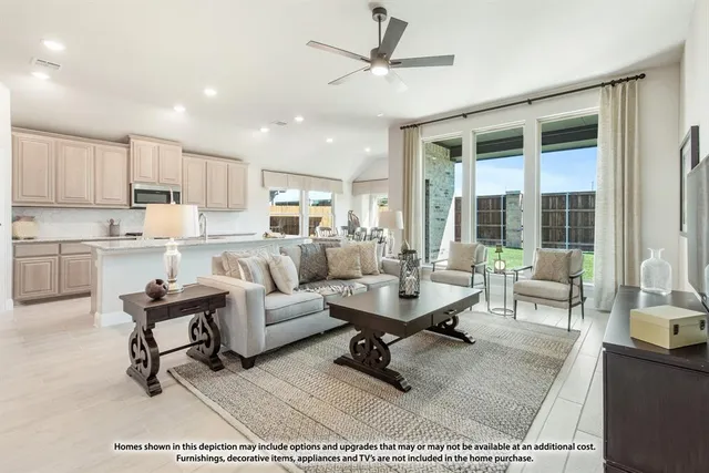 a large kitchen with stainless steel appliances granite countertop a lot of counter space a sink and view living room