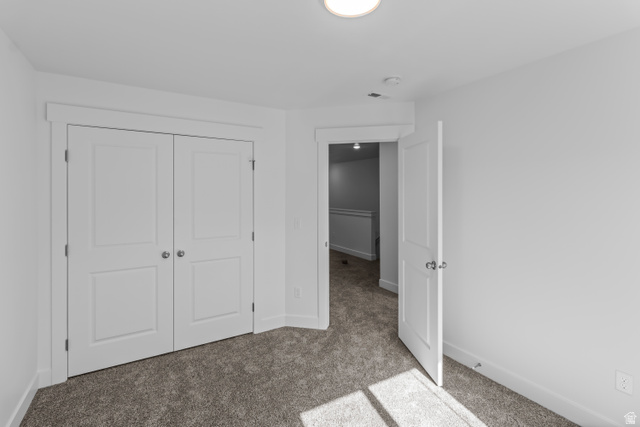 2995 South 265th Street West, Unit 752 Logan, UT 84321 - Photo 15 of 21 Room featuring neutral carpeting, white walls, and a ceiling-mounted light fixture