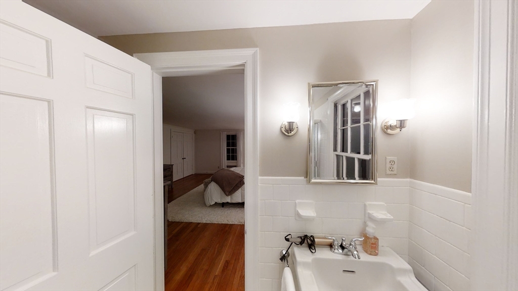 78 Draper Road Wayland, MA 01778 - Photo 13 of 14 a bathroom with a sink and a mirror