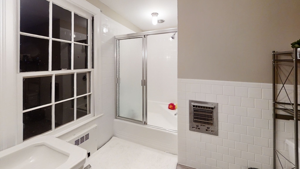 78 Draper Road Wayland, MA 01778 - Photo 14 of 14 a view of an empty room with wooden floor and a window