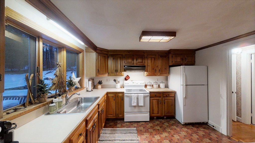 78 Draper Road Wayland, MA 01778 - Photo 5 of 14 a kitchen that has a sink and a refrigerator
