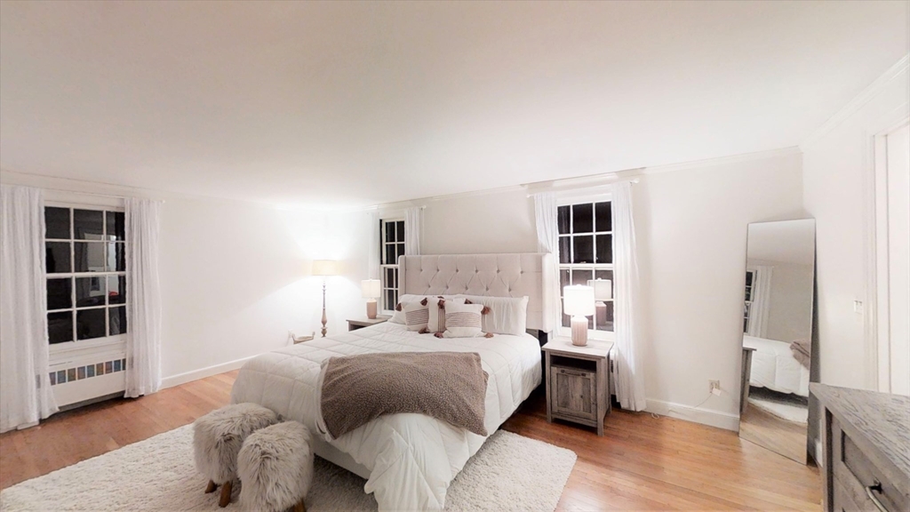 78 Draper Road Wayland, MA 01778 - Photo 8 of 14 a bedroom with a bed and wooden floor