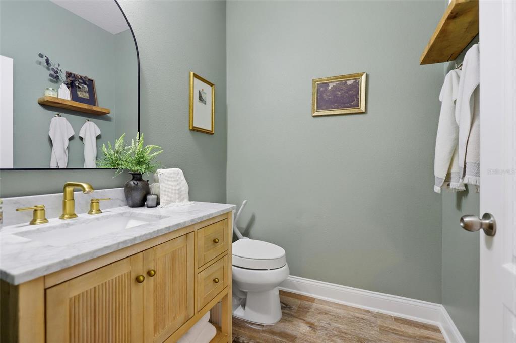 162 Ancona Avenue DeBary, FL 32713 - Photo 11 of 51 a bathroom with a granite countertop sink mirror vanity and toilet