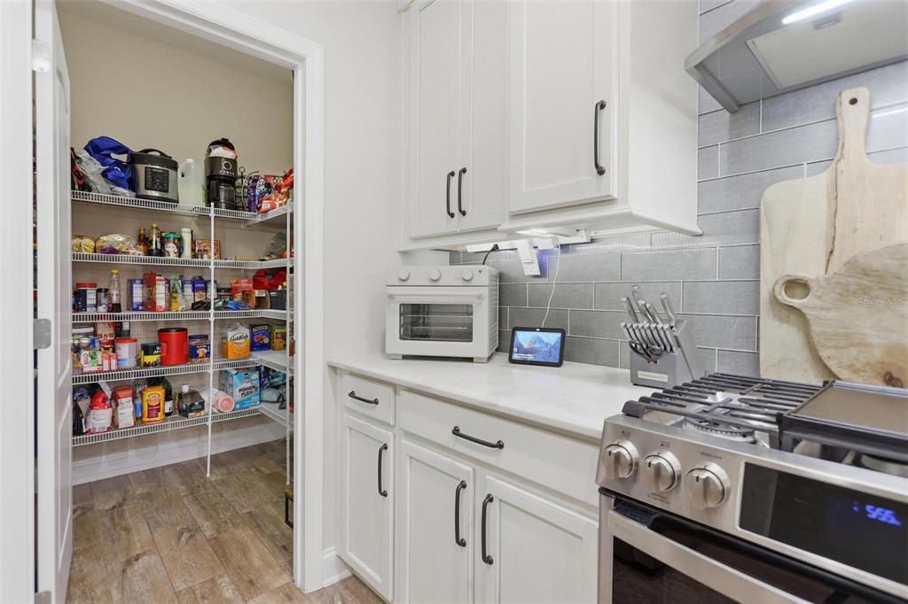 162 Ancona Avenue DeBary, FL 32713 - Photo 15 of 51 a kitchen with stainless steel appliances granite countertop a stove and a refrigerator