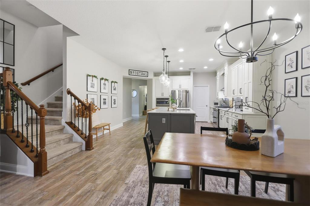 162 Ancona Avenue DeBary, FL 32713 - Photo 17 of 51 a view of a dining room with furniture and a chandelier