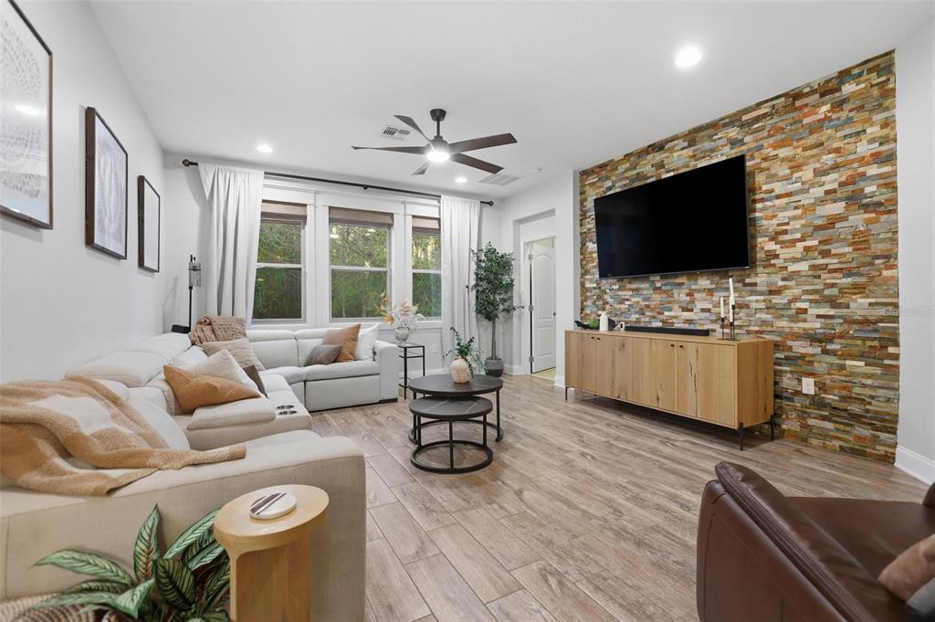 162 Ancona Avenue DeBary, FL 32713 - Photo 20 of 51 a living room with furniture and a flat screen tv