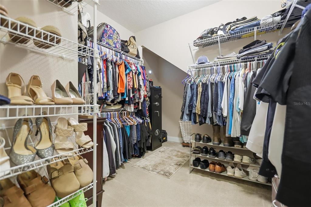 162 Ancona Avenue DeBary, FL 32713 - Photo 24 of 51 a view of walk in closet with clothes and shoes