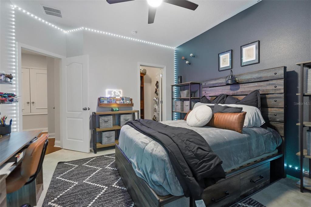 162 Ancona Avenue DeBary, FL 32713 - Photo 35 of 51 a bedroom with a bed and wooden floor