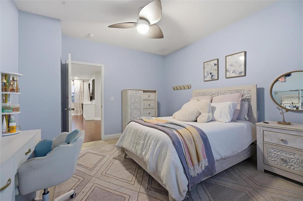 162 Ancona Avenue DeBary, FL 32713 - Photo 37 of 51 a bedroom with a bed and wooden floor