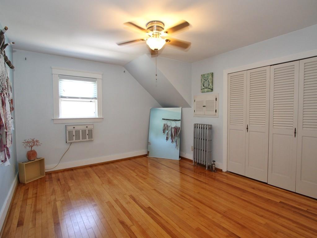 65 King Philip Road Worcester, MA 01606 - Photo 6 of 15 wooden floor in an empty room with a window