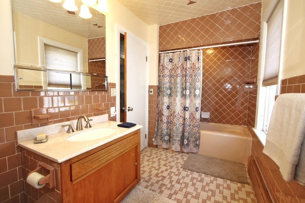 65 King Philip Road Worcester, MA 01606 - Photo 8 of 15 a bathroom with a sink and a bathtub