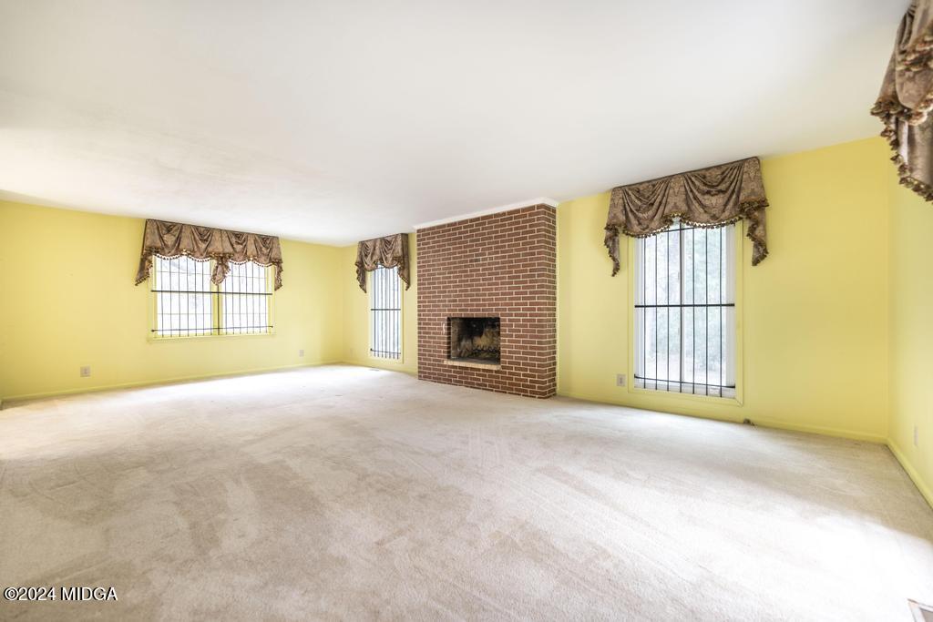 6909 Forsyth Road Macon, GA 31210 - Photo 11 of 53 a view of a livingroom with a fireplace