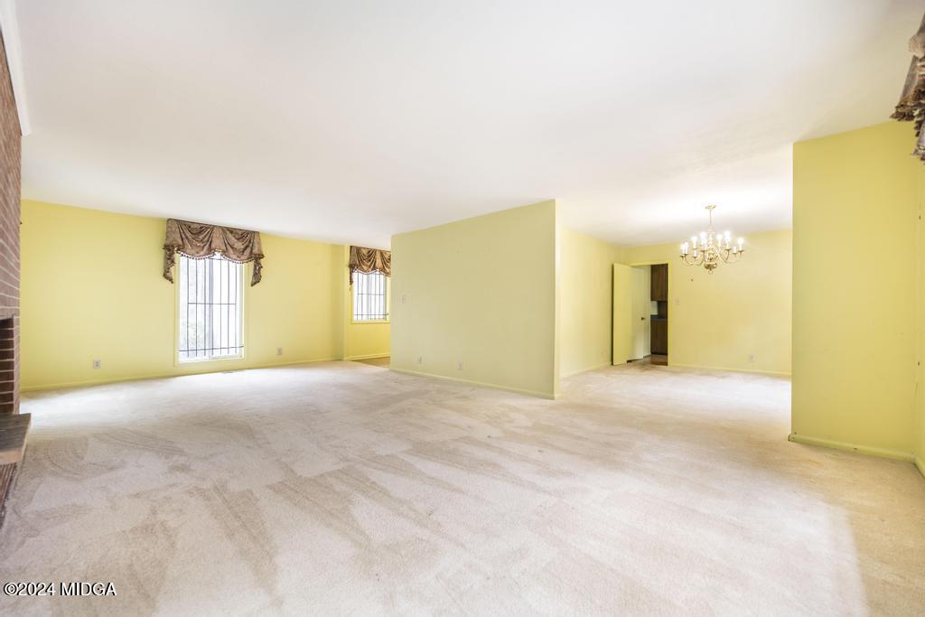 6909 Forsyth Road Macon, GA 31210 - Photo 12 of 53 a view of an empty room with a window