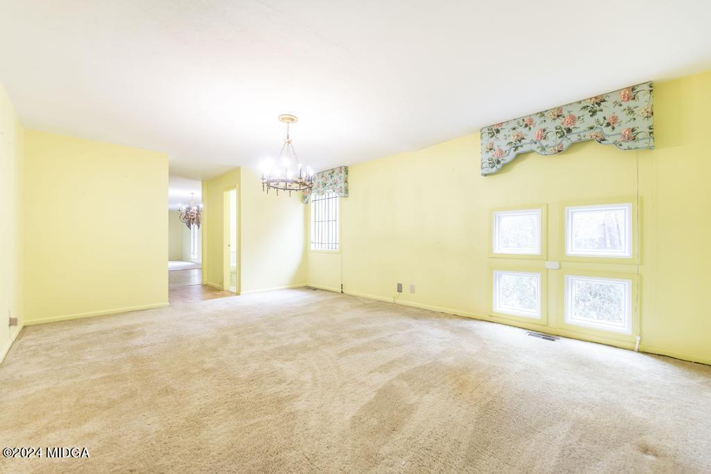 6909 Forsyth Road Macon, GA 31210 - Photo 20 of 53 a view of an empty room with a window