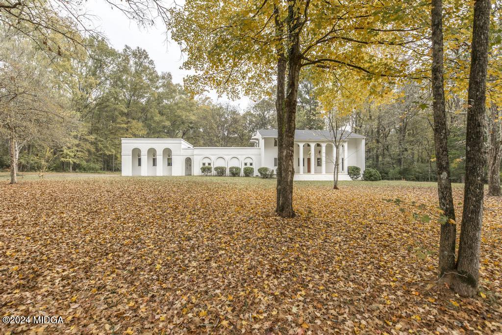 6909 Forsyth Road Macon, GA 31210 - Photo 2 of 53 a front view of a house with a yard