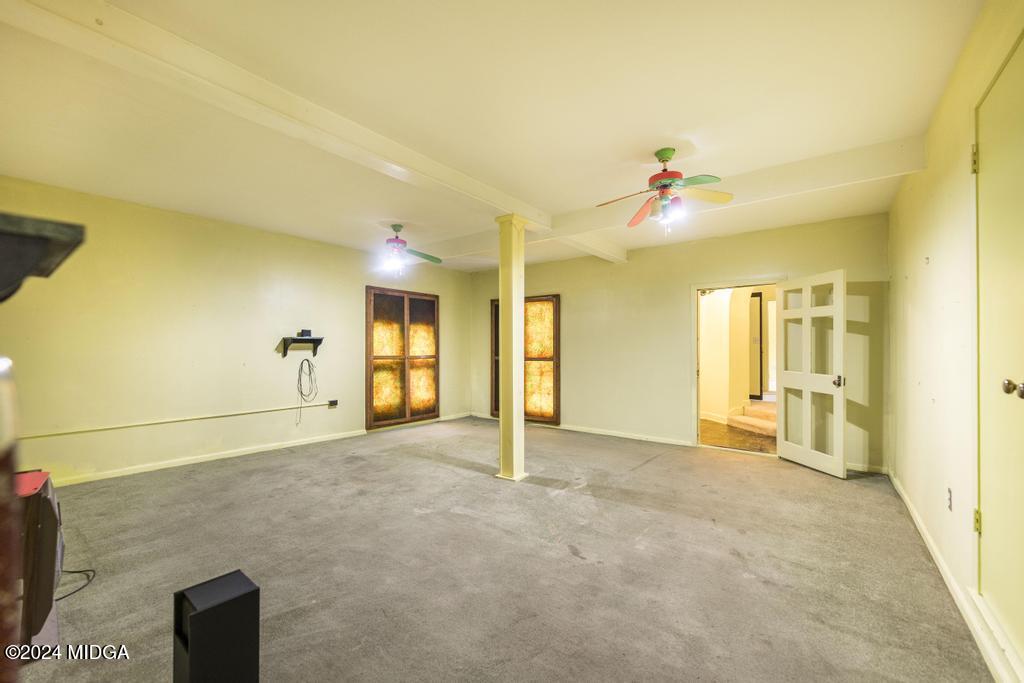 6909 Forsyth Road Macon, GA 31210 - Photo 24 of 53 a view of a livingroom with a staircase