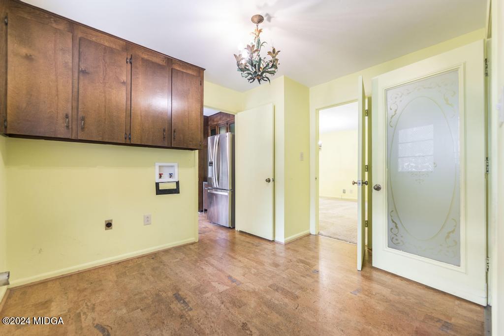 6909 Forsyth Road Macon, GA 31210 - Photo 25 of 53 a view of a hallway with a chandelier
