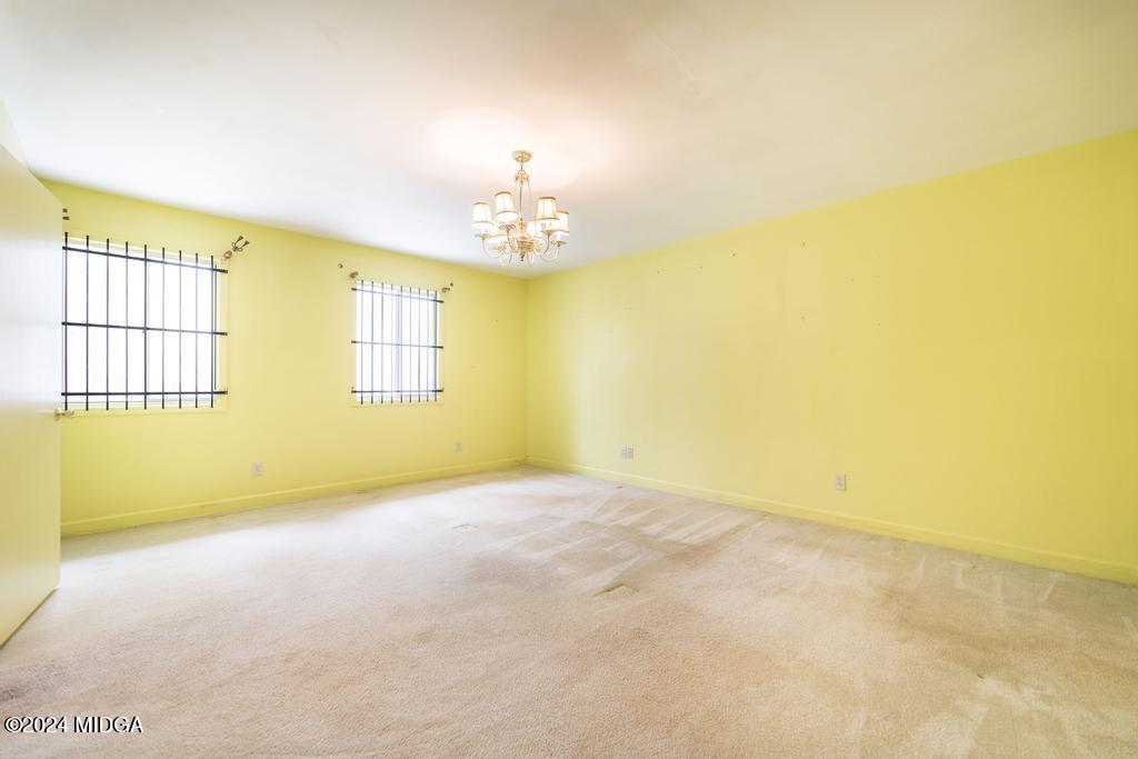 6909 Forsyth Road Macon, GA 31210 - Photo 28 of 53 an empty room with windows