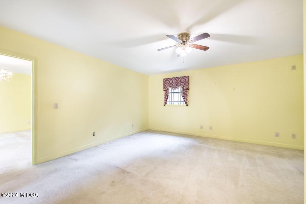 6909 Forsyth Road Macon, GA 31210 - Photo 30 of 53 an empty room with windows and fan
