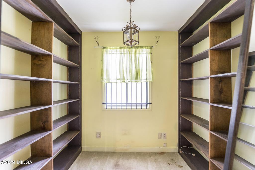 6909 Forsyth Road Macon, GA 31210 - Photo 32 of 53 a view of an empty room with shelves