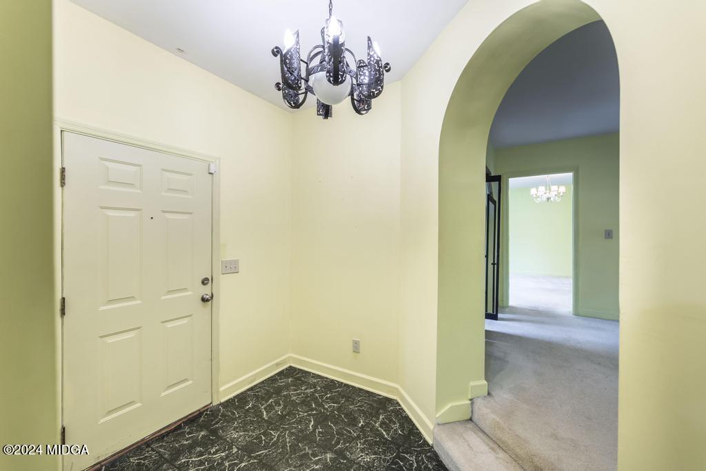 6909 Forsyth Road Macon, GA 31210 - Photo 33 of 53 a view of a chandelier in a room
