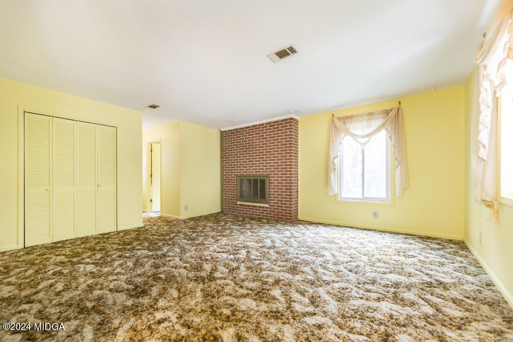6909 Forsyth Road Macon, GA 31210 - Photo 36 of 53 a view of a bedroom with a natural light