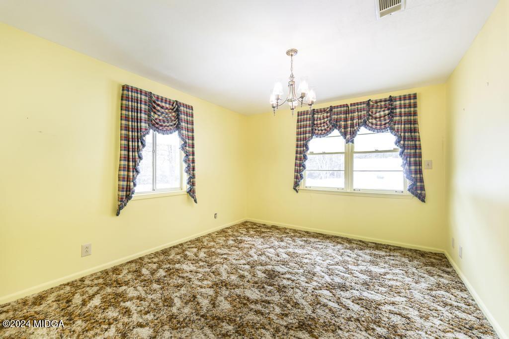 6909 Forsyth Road Macon, GA 31210 - Photo 40 of 53 a view of an empty room and window