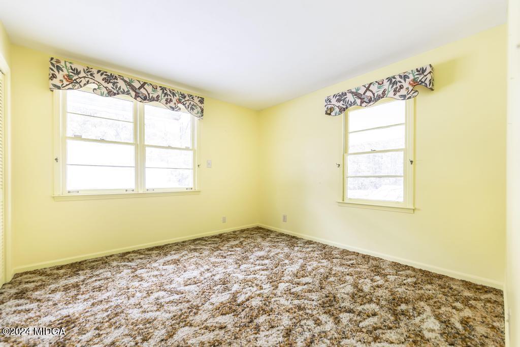 6909 Forsyth Road Macon, GA 31210 - Photo 45 of 53 a view of an empty room and window